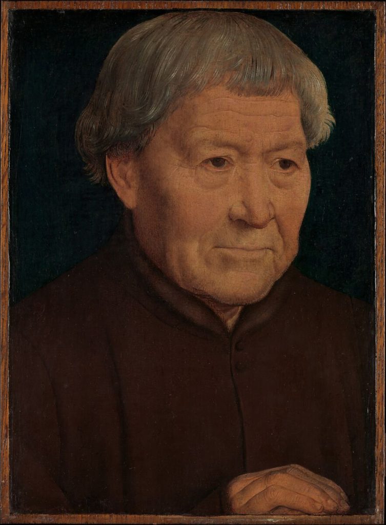A portrait of an older man, who looks kind